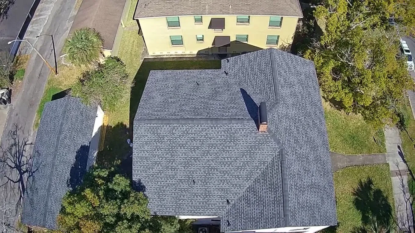 Overhead aerial view of a gray shingle roof.